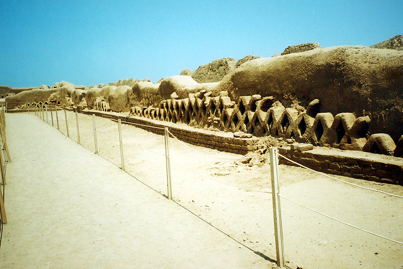 Eroding adobe walls at Chan Chan under coastal climate stress